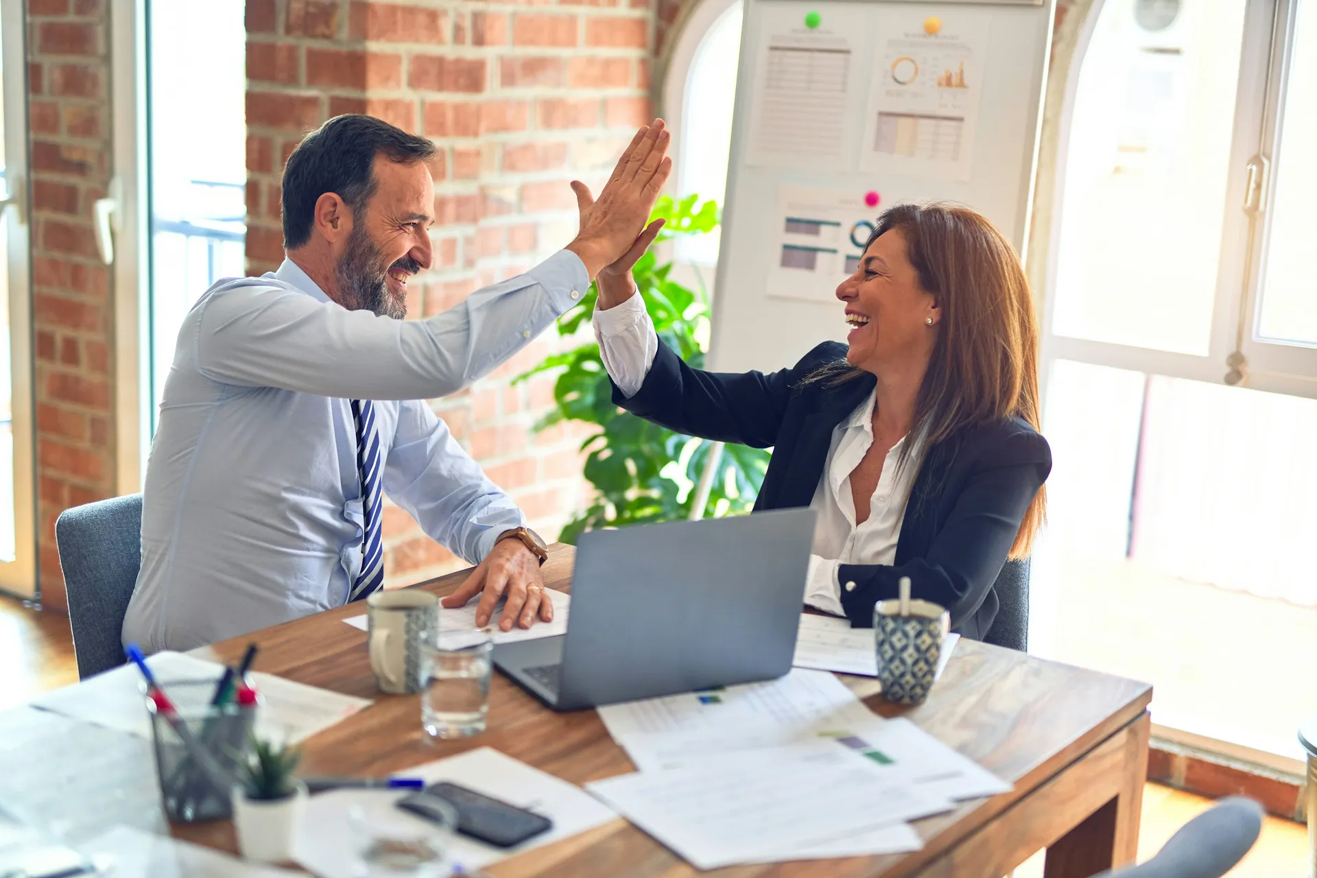 Business professionals reviewing a planning discussion in an office