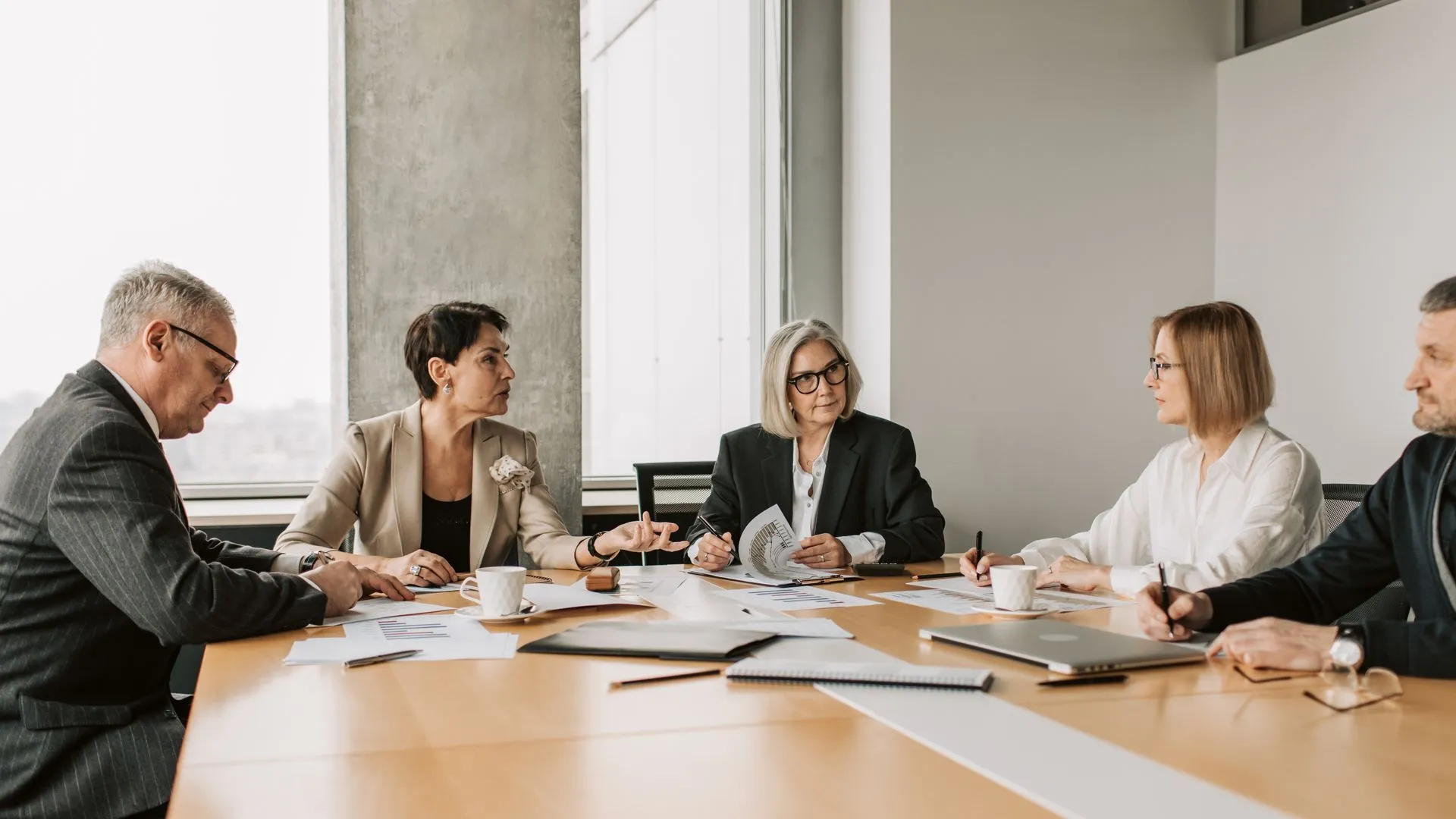 Professionals collaborating during a risk discussion